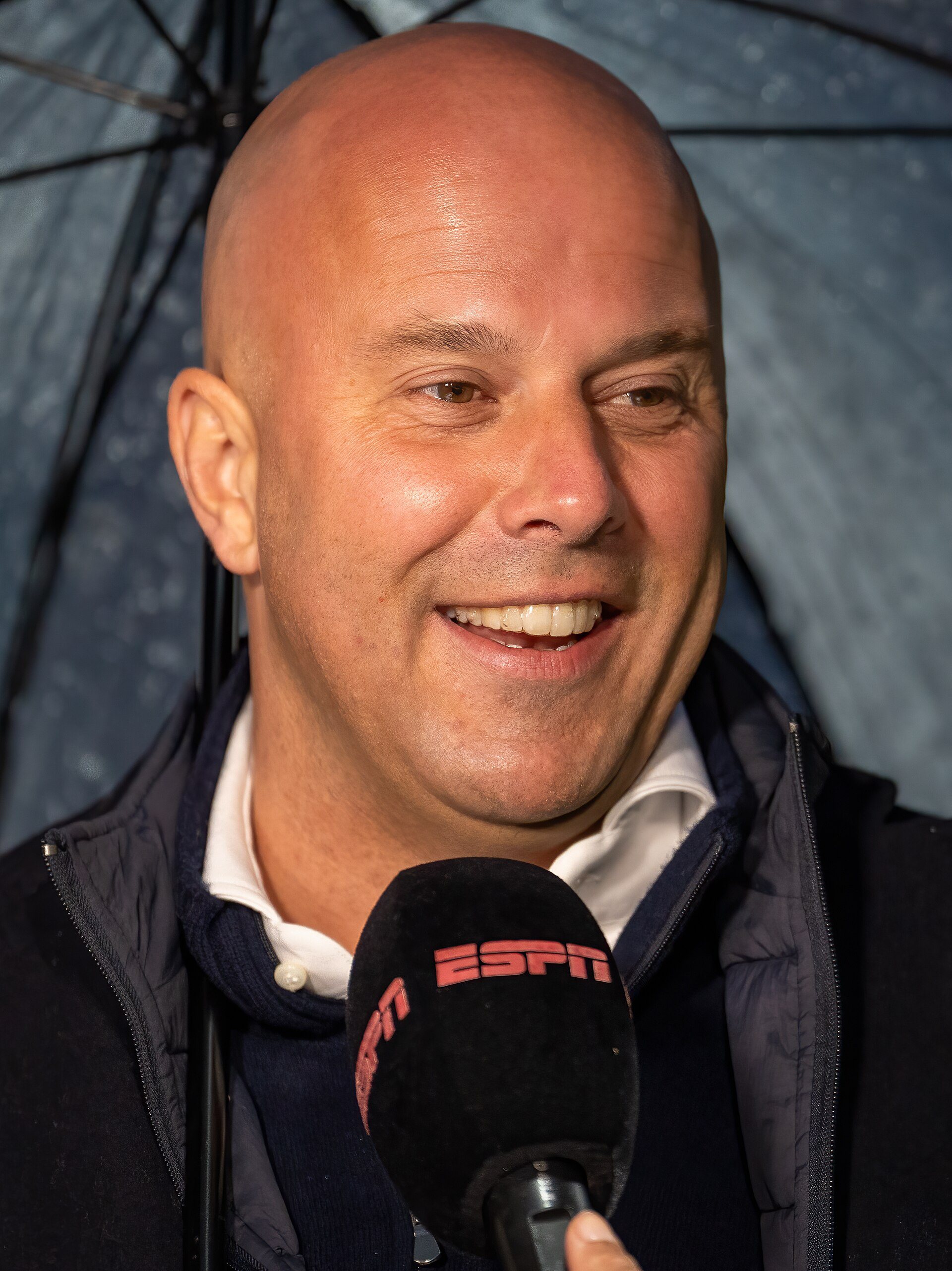 Arne Slot speaking during a football media appearance